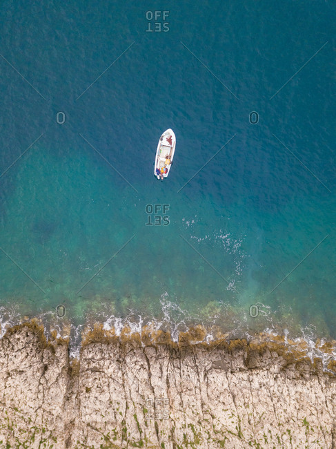 Aerial view of single speed boat floating over transparent water, Croatia.