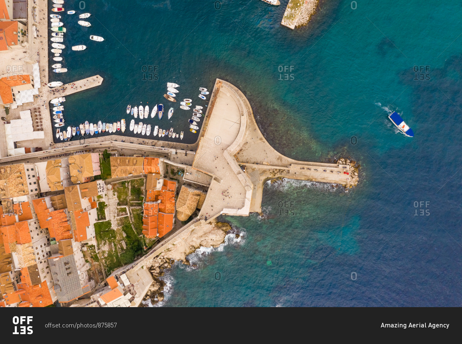Aerial view of boat sailing near Dubrovnik old town, Croatia.