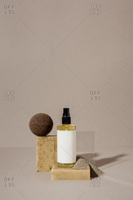 Soaps, oil, and bath bombs on light background