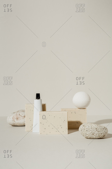 Soaps, lotion, and bath bombs on light background