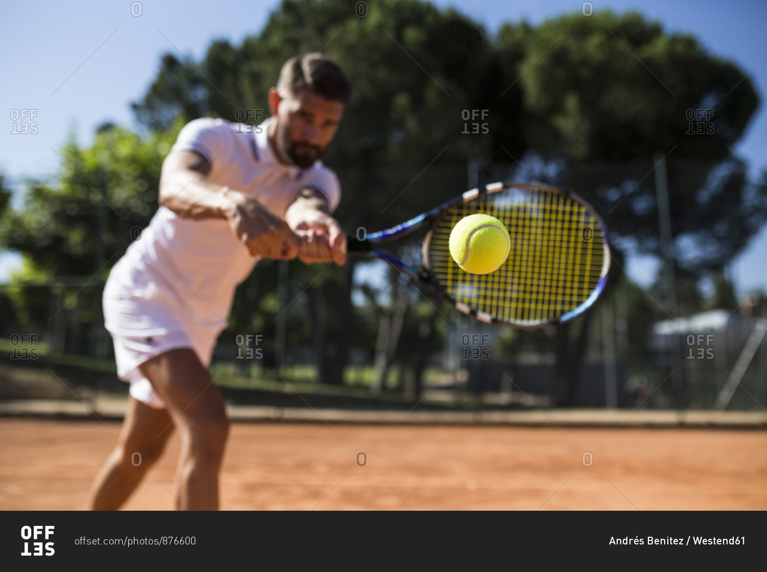 Tennis player during a tennis match- focus on tennis ball