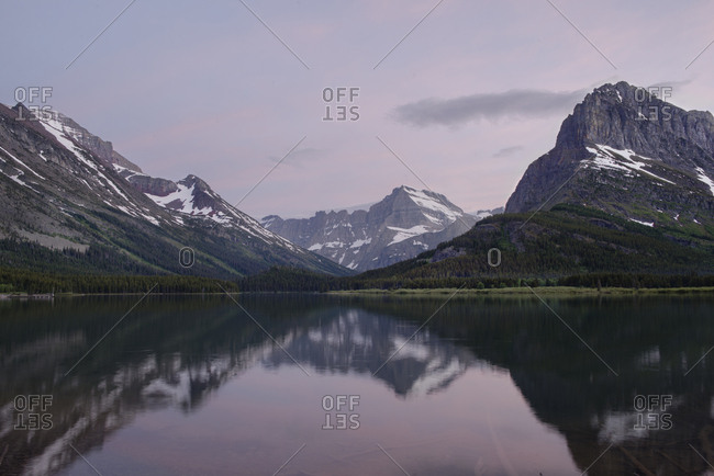 Scenic view of Swift current Lake against Mt. Grinnell