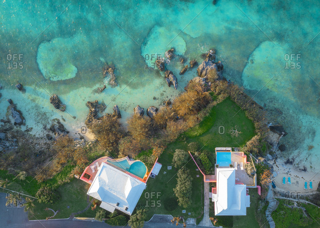 Two private houses are on the green cliff in Bermuda