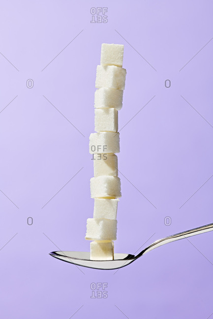 Sugar Cubes Stacked on a Spoon