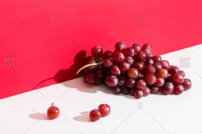 Bunch of red grapes on a white table