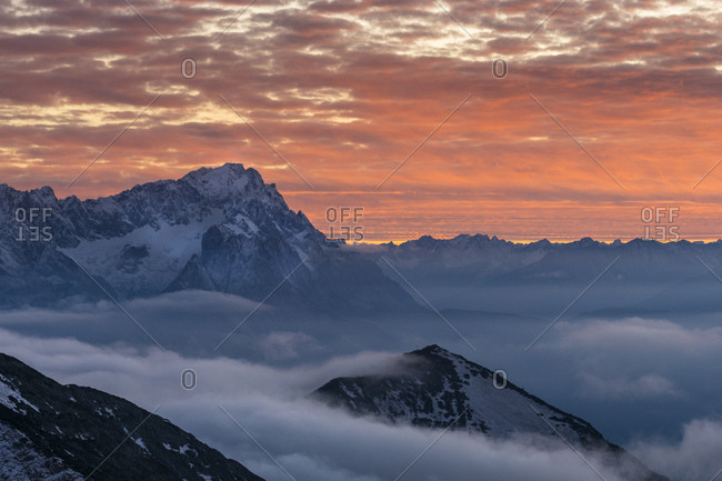 Germany, bavaria, bavarian alps, garmisch-partenkirchen, zugspitze in the nebulous sea at sundown