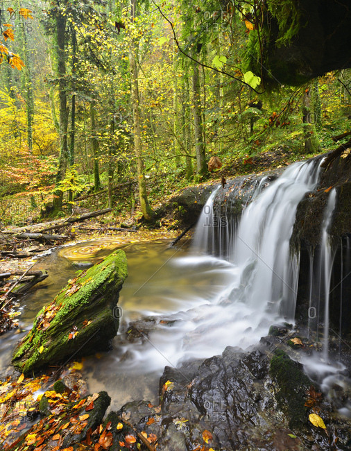 Germany, baden-wurttemberg, swabian-franconian forest, close backnang, strumpfelbachtal, waterfall in the course of the strumpflebach (brook), colorful autumn foliage