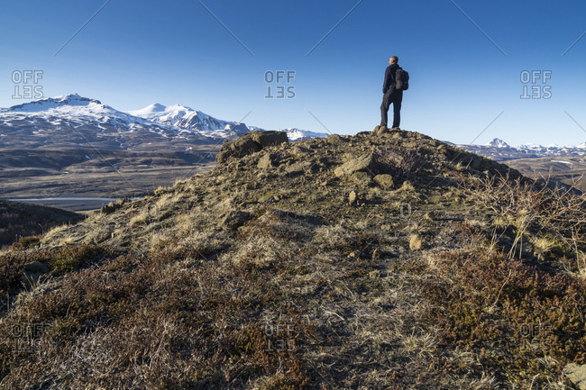 Northern europe, iceland, highland, hiker looks above the icelandic highland thorsmork