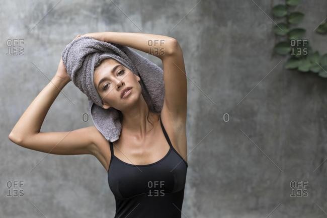 Portrait of a beautiful woman with a towel on her head