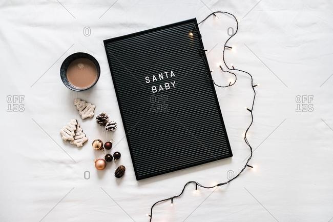Hot chocolate, Christmas cookies and a letter board with fairy lights