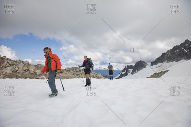 Three mountaineers en route towards Cypress Peak, B.C.