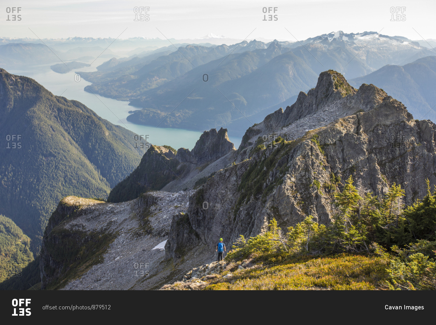 Lone climber looking over Coast Mountains and Harrison Lake, B.C.