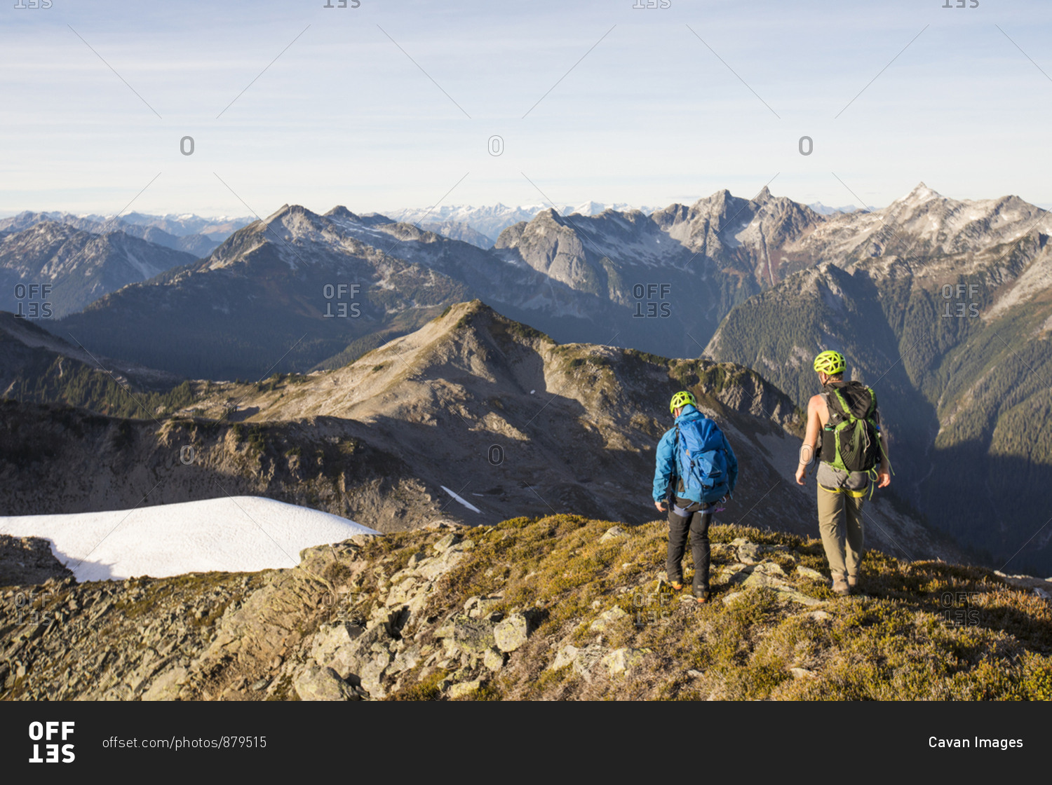 Backpackers hiking along high mountain ridge, B.C.