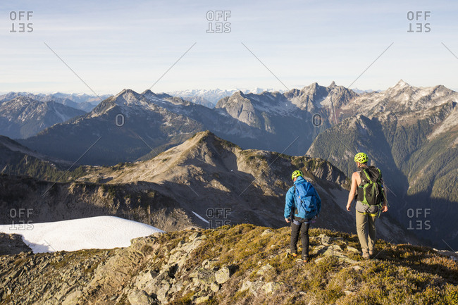 Backpackers hiking along high mountain ridge, B.C.