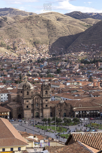 Peru, Cusco - October 21, 2016: High angle view of cathedral amidst houses against mountains in city