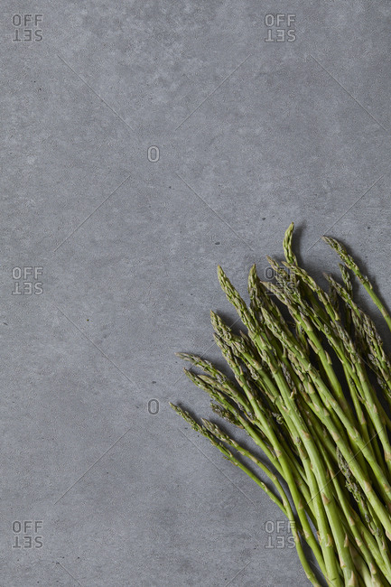 Overhead view of asparagus on concrete table