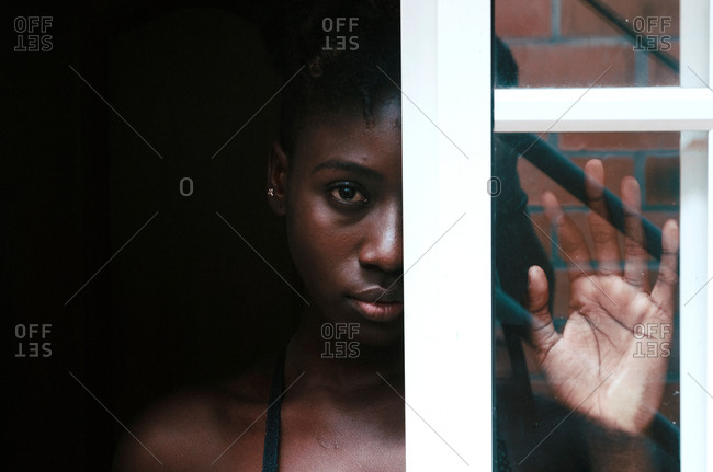 black woman looking in the mirror