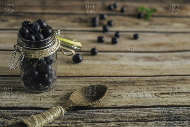 Tasty bilberry on wooden surface