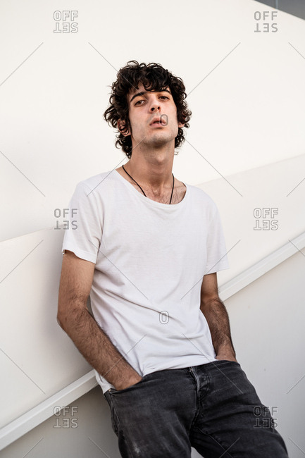 handsome man with dark hair stock photos - OFFSET