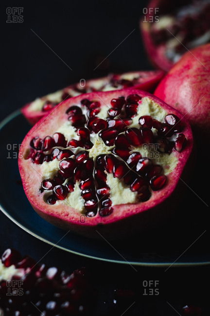 Still Life of Opened Pomegranates in Dark and Moody Background