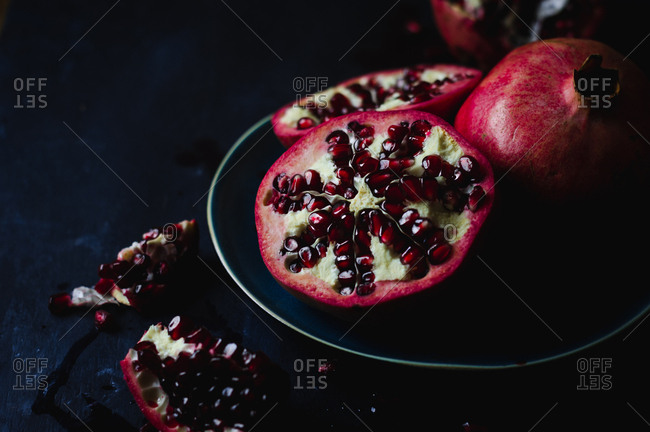 Still Life of Opened Pomegranates in Dark and Moody Background
