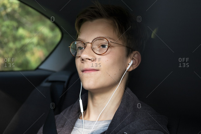 Boy in car looking away