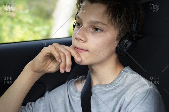 Boy in car looking away