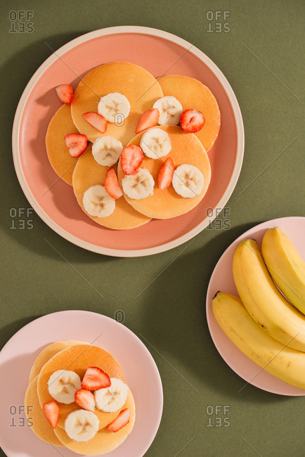 Homemade pancakes topped with strawberries and bananas