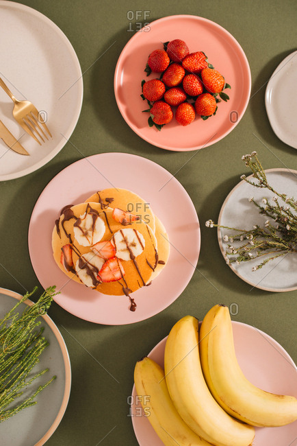 Homemade pancakes topped with strawberries and bananas