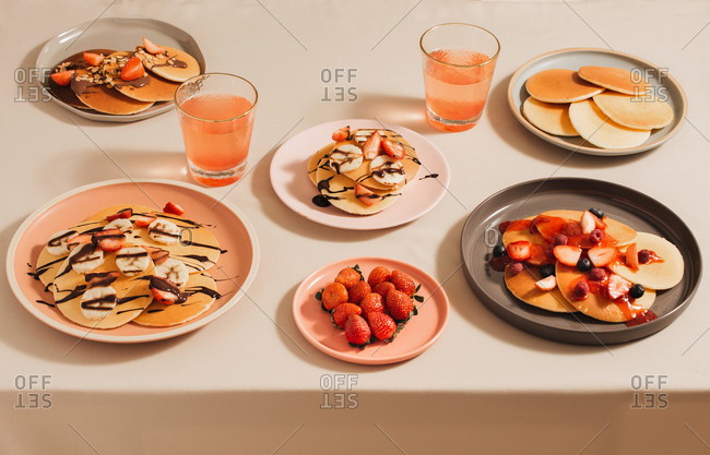 Homemade pancakes topped with strawberries and bananas