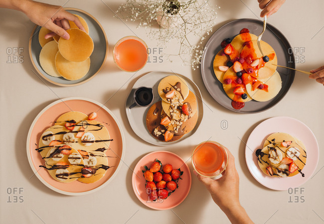 Homemade pancakes topped with strawberries and bananas