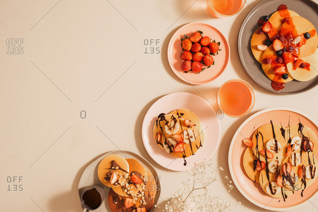 Homemade pancakes topped with strawberries and bananas