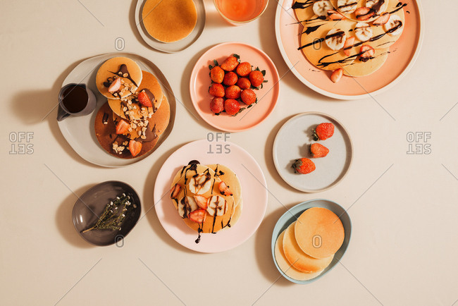 Homemade pancakes topped with strawberries and bananas