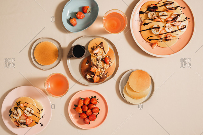 Homemade pancakes topped with strawberries and bananas