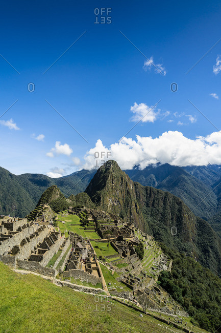 Elevated view of historic Incan Machu Picchu on mountain in Andes, Cuzco Region, Peru