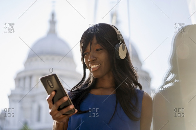 Female Afro-American listening to music in London- England- Great Britain