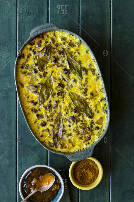 Top view of a South African Bobotie dish with curried ground beef, baked with a rich savory custard