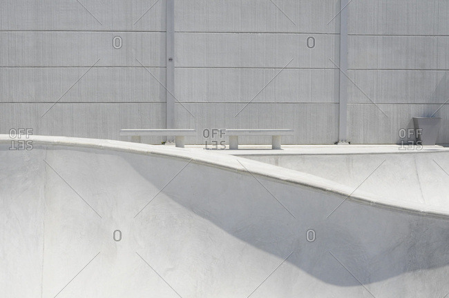 Modern minimalist concrete bowl in skatepark