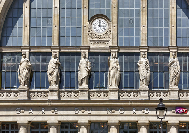 June 8, 2015: France, Paris, station building, facade, statues, clock, 15 o'clock,