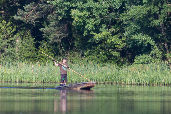 September 7, 2013: Fisherman in a hooker on a lake