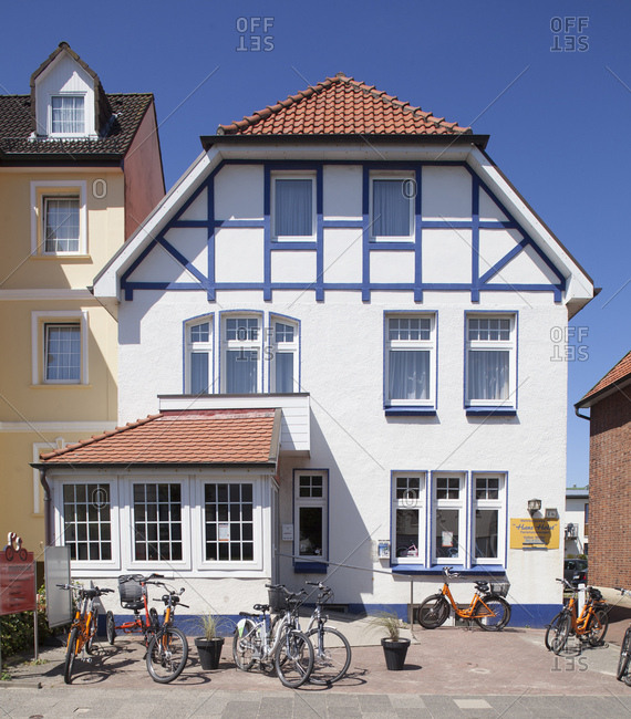 July 11, 2014: Wehrbergsweg, house with bicycle for rent in cuxhaven-duhnen, north sea spa cuxhaven, lower saxony, Germany, europe