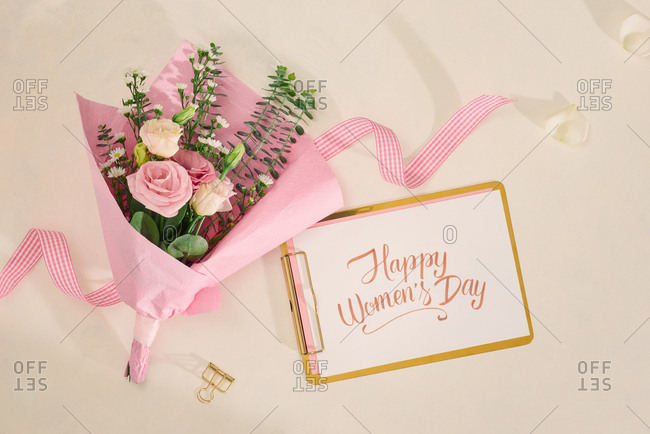 Happy valentines day with flower bouquet on white background. Top view, flatlay