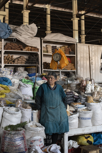 Cusco, Peru - April 4, 2019: Senior woman vendor in San Pedro Market