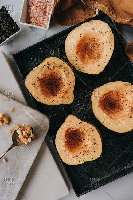 Acorn squash on dark tray