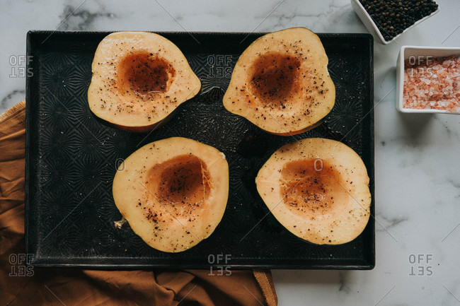 Top view of acorn squash on dark tray