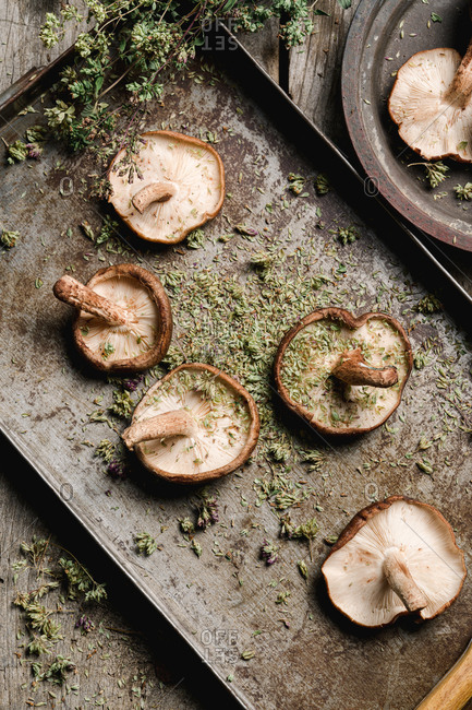 Pile of fresh brown mushrooms on rustic wooden table