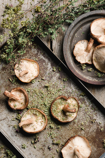 Pile of fresh brown mushrooms on rustic wooden table