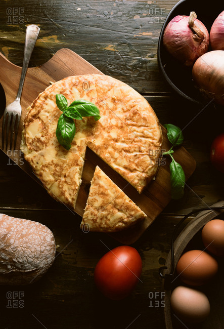 Cooking ingredients around pie on table