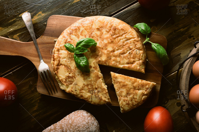 Cooking ingredients around pie on table