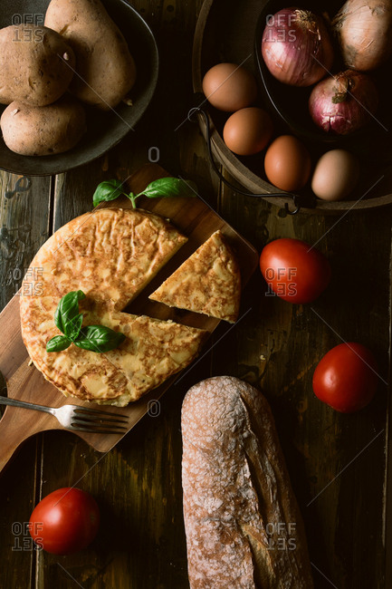 Cooking ingredients around pie on table